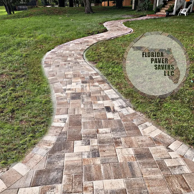 Winding multicolor paver garden path with a contrasting border