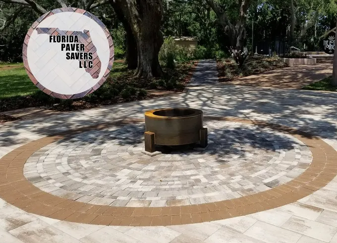 Commercial circular fire pit patio with a contrasting border and surrounding pavers